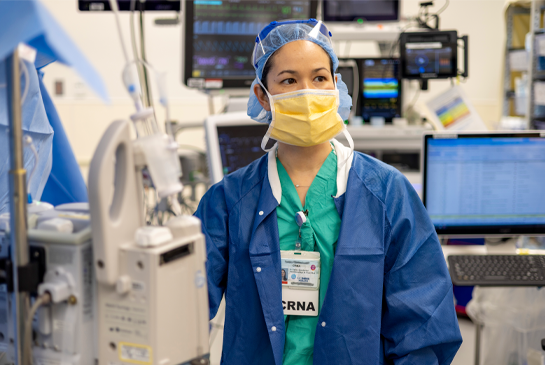 CRNA working in operating room.
